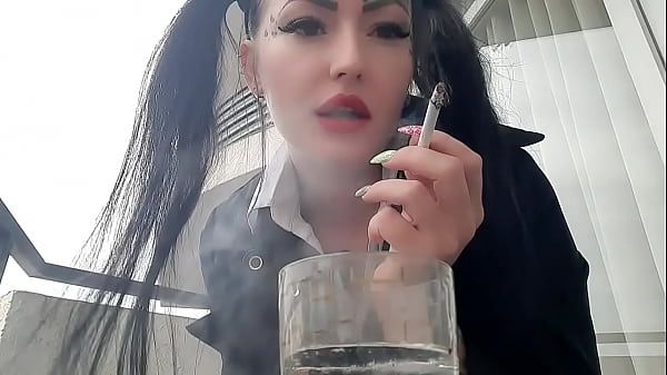 Smoking fetish. Dominatrix Nika smokes sexy and spits into a glass. Imagine that this glass is your mouth, and you are just an ashtray for Mistress.